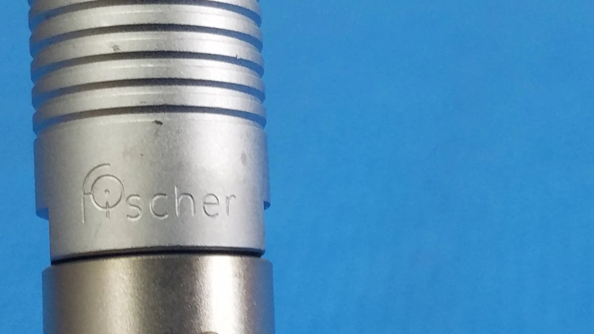 Silver metallic scher handpiece cable with ribbed grip and engraved fischer logo for reuse medical equipment