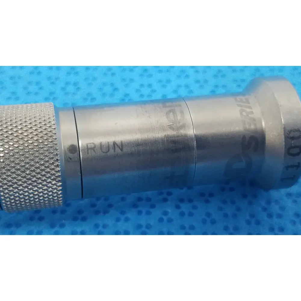Silver metallic stryker series straight micro drill with knurled grip and engraved run series 100 markings