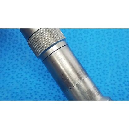 Silver metallic torque wrench with textured grip and engraved markings for stryker series straight micro drill orthopedic attachment
