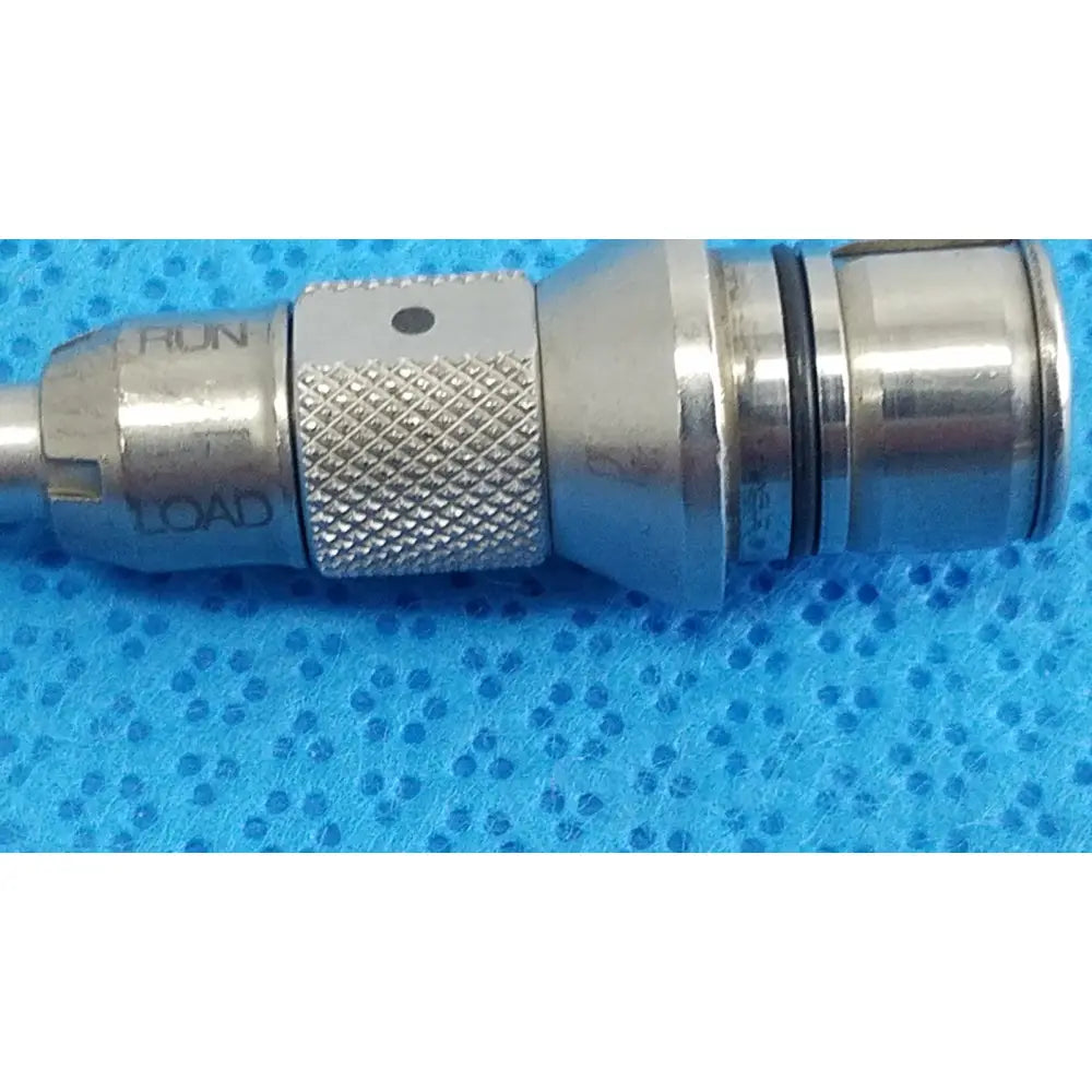 Silver metallic tsp saber straight attachment with textured grip and engraved run and load markings by stryker