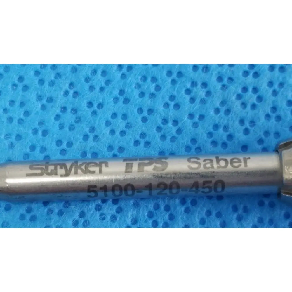 Silver-colored metal tsp saber straight surgical attachment labeled stryker tps saber 5100-120-450 for precise cutting