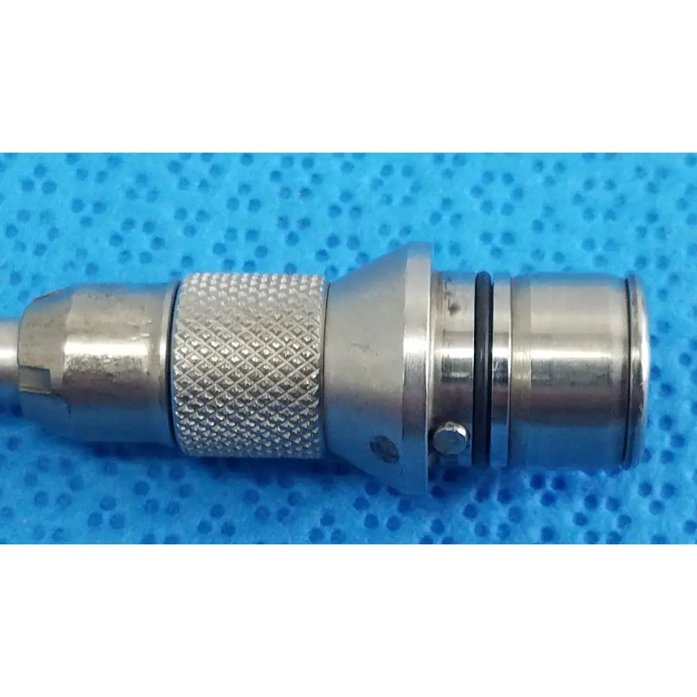 Silver-colored metal tsp saber straight attachment with textured knurled grip and smooth cylindrical body by Stryker
