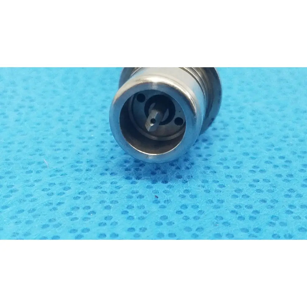 Silver metallic tsp saber drill with cylindrical body and internal mechanical components for reuse medical use