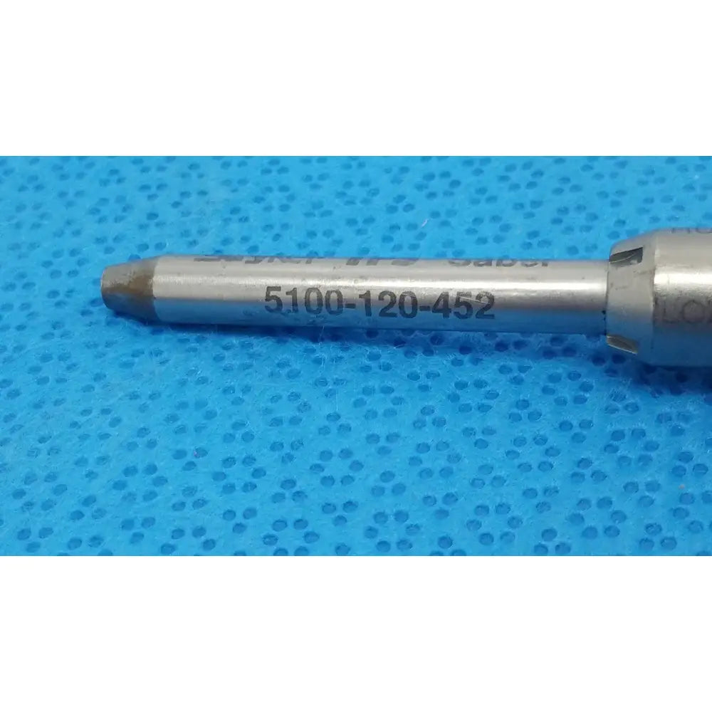 Silver-colored metal tsp saber drill bit with engraved markings and tapered tip for precision dental use