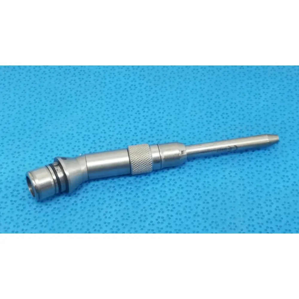 Silver tsp saber drill bit with textured grip and precision-engineered tip for reuse medical procedures