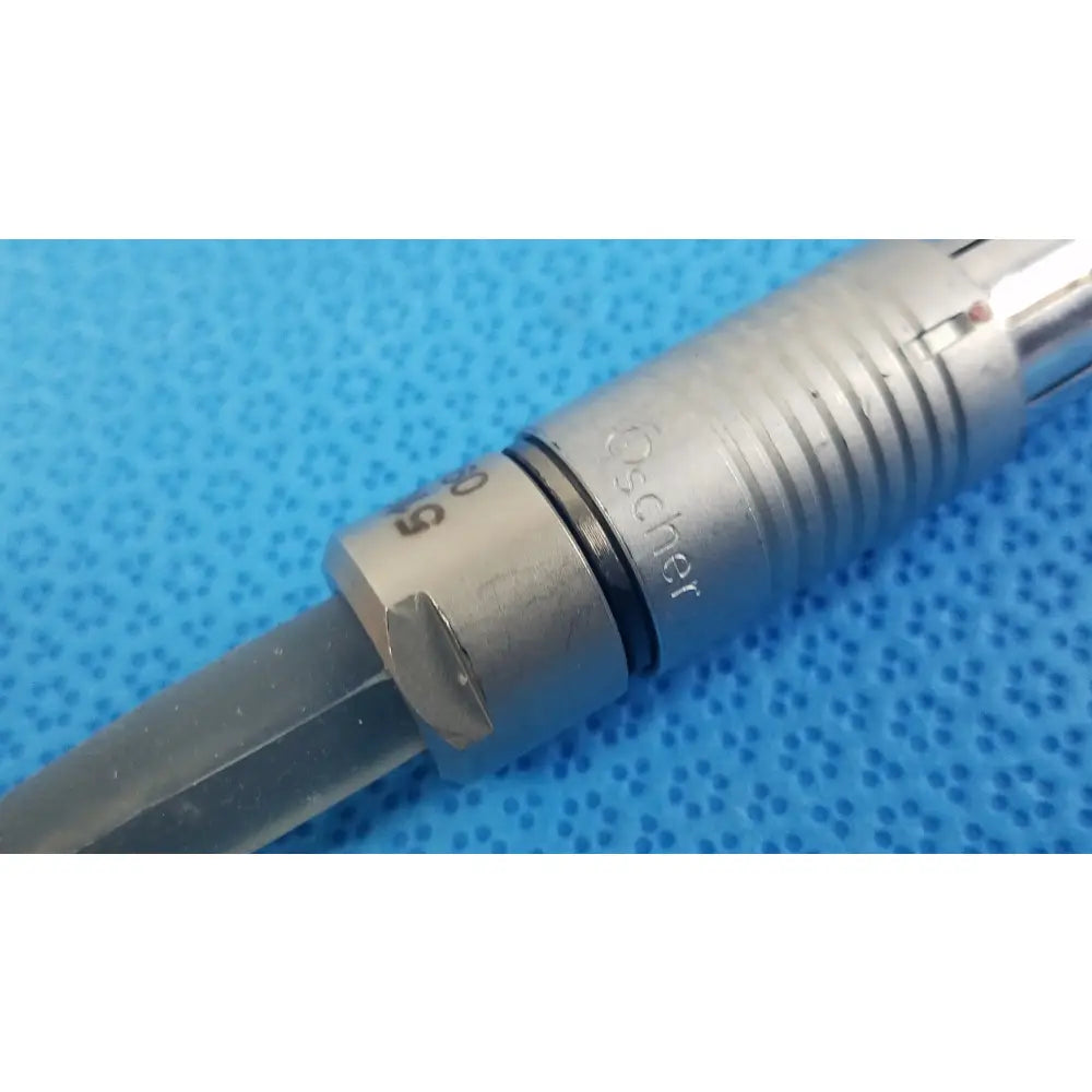 Silver-colored metal scher handpiece cable with engraved oscher branding and ribbed grip for reuse medical equipment