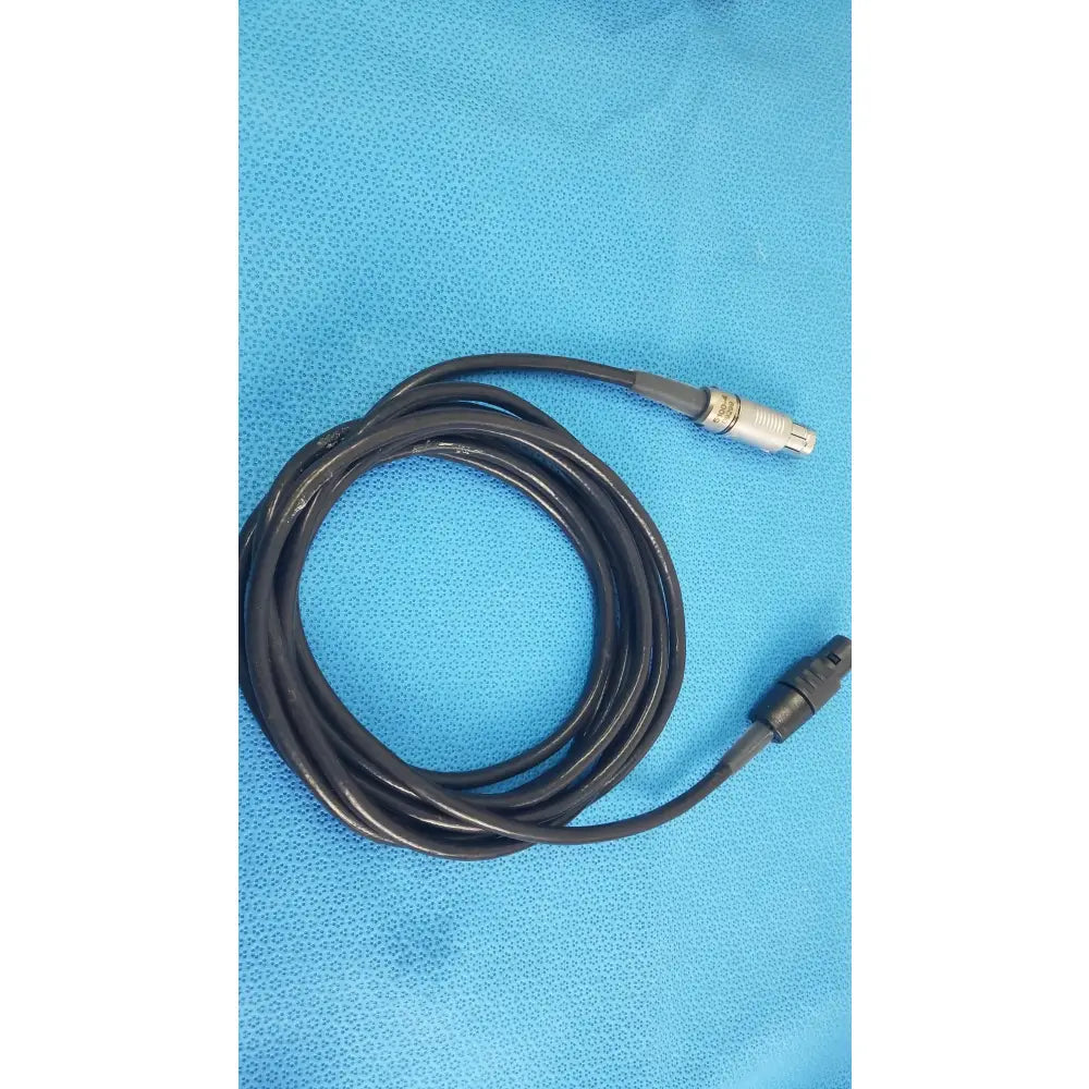 Black coiled medical equipment cable with silver and black connectors for reuse medical equipment scher handpiece cable