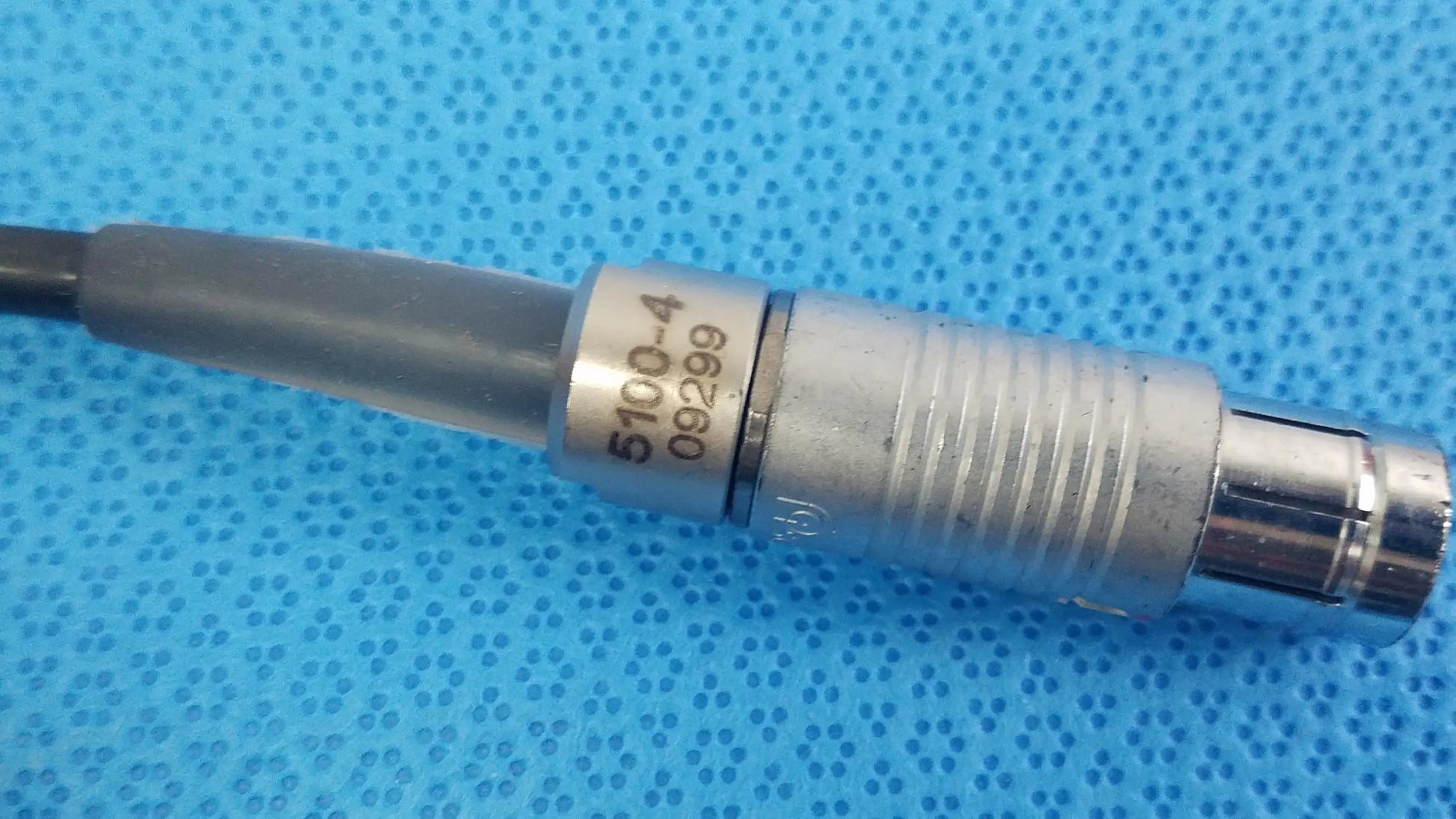 Silver metallic scher handpiece cable model 5100-4 with ribbed barrel for reuse medical equipment in medical settings
