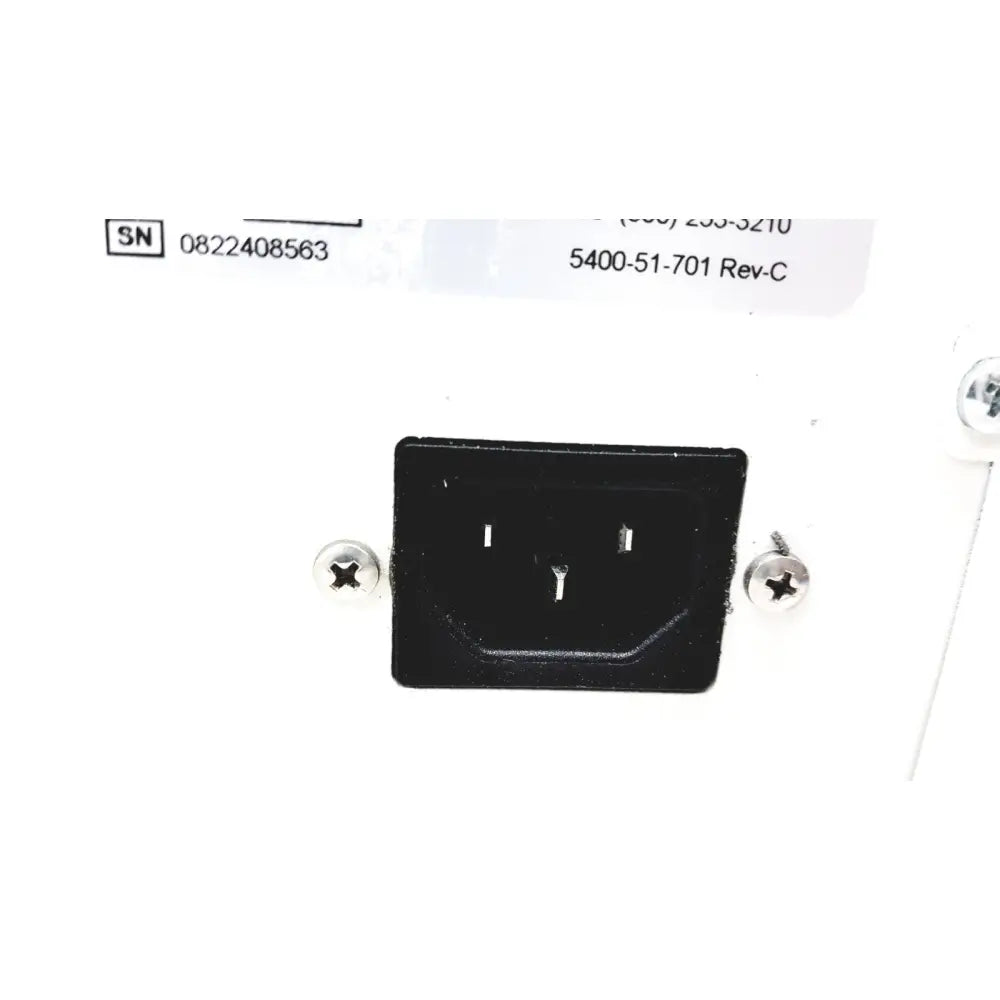 Black plastic power input plug with two flat pins and grounding pin on the back of stryker 5400-50 core powered instrument driver surgical handpiece