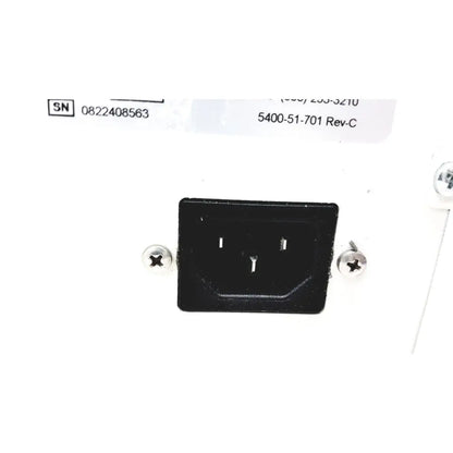 Black plastic power input plug with two flat pins and grounding pin on the back of stryker 5400-50 core powered instrument driver surgical handpiece