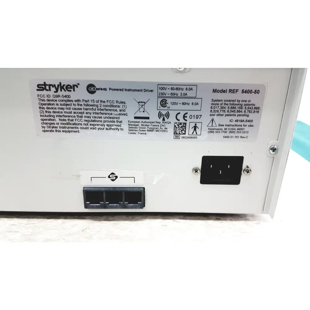 White plastic stryker 5400-50 core powered instrument driver with black power input and specification label back view