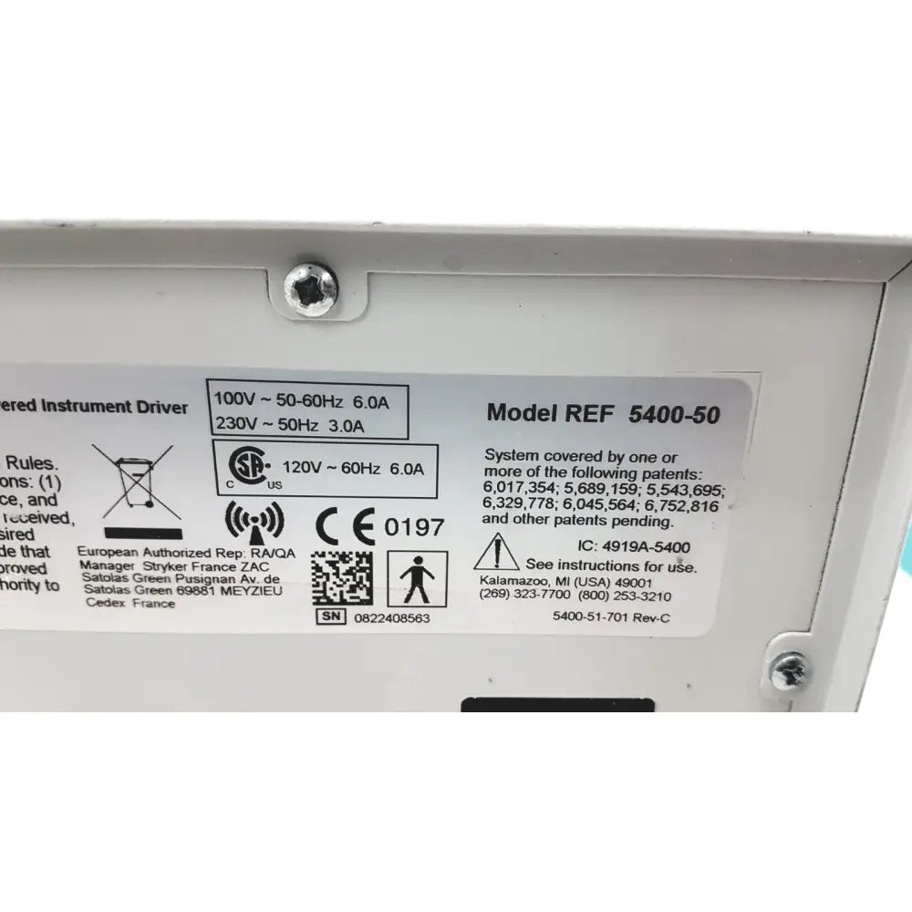 White plastic label with black text on the back of stryker 5400-50 core powered instrument driver surgical handpiece