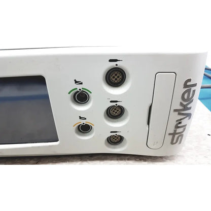 White stryker 5400-50 core powered instrument driver surgical handpiece with circular ports and small screen visible