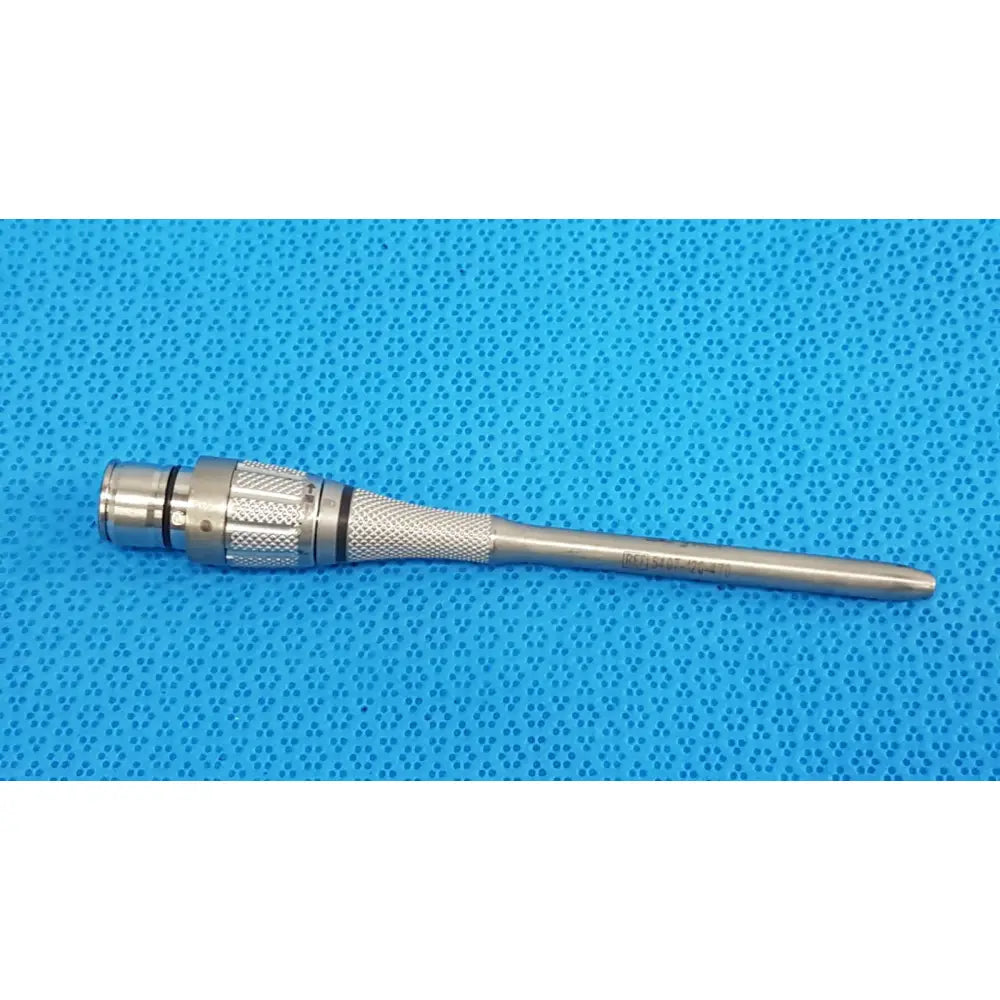 Silver stryker maestro attachment surgical power tool component with textured grip and engraved markings