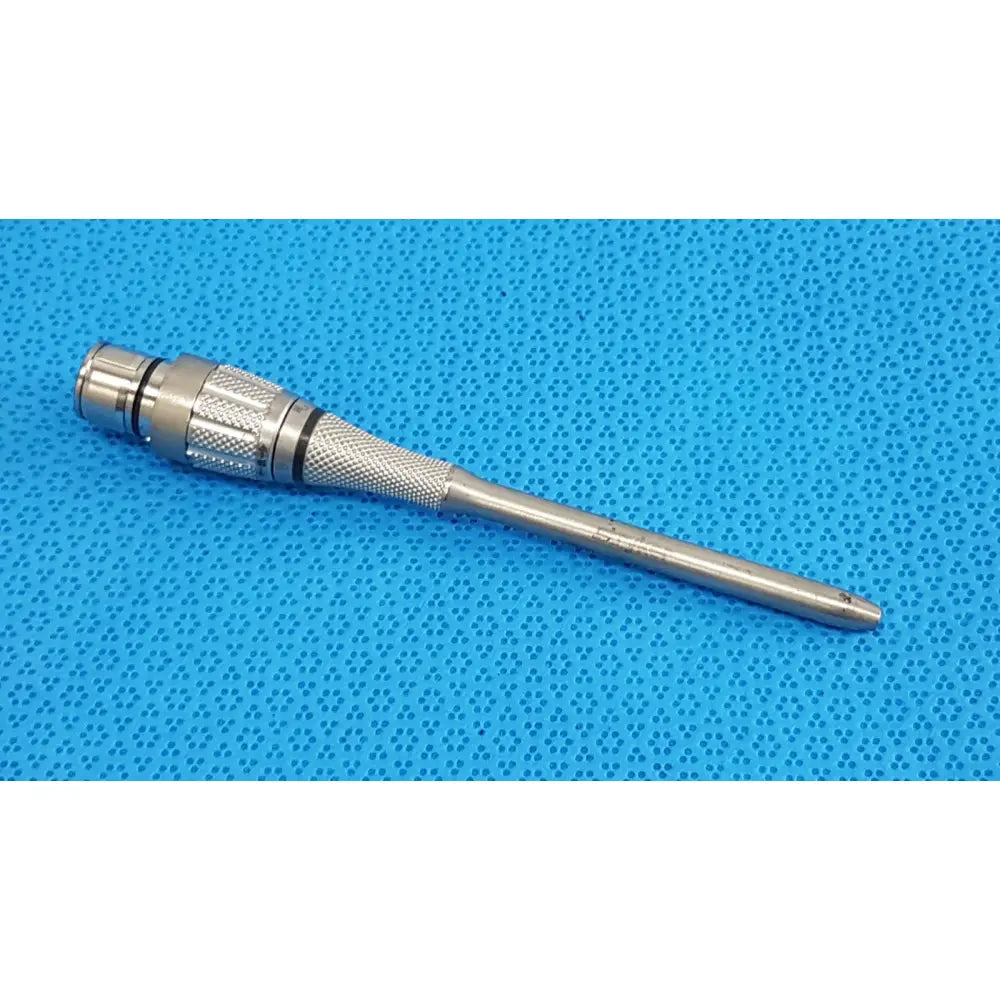Silver surgical power maestro attachment with textured grip and threaded tip for surgical power tool use