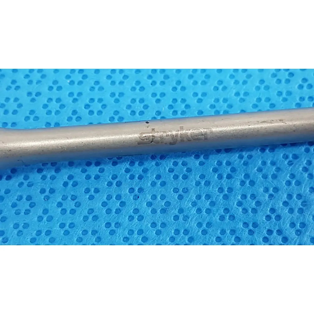 Silver-colored metal stryker maestro attachment surgical power tool component for precise surgical power use