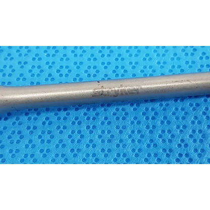 Silver-colored metal stryker maestro attachment surgical power tool component for precise surgical power use