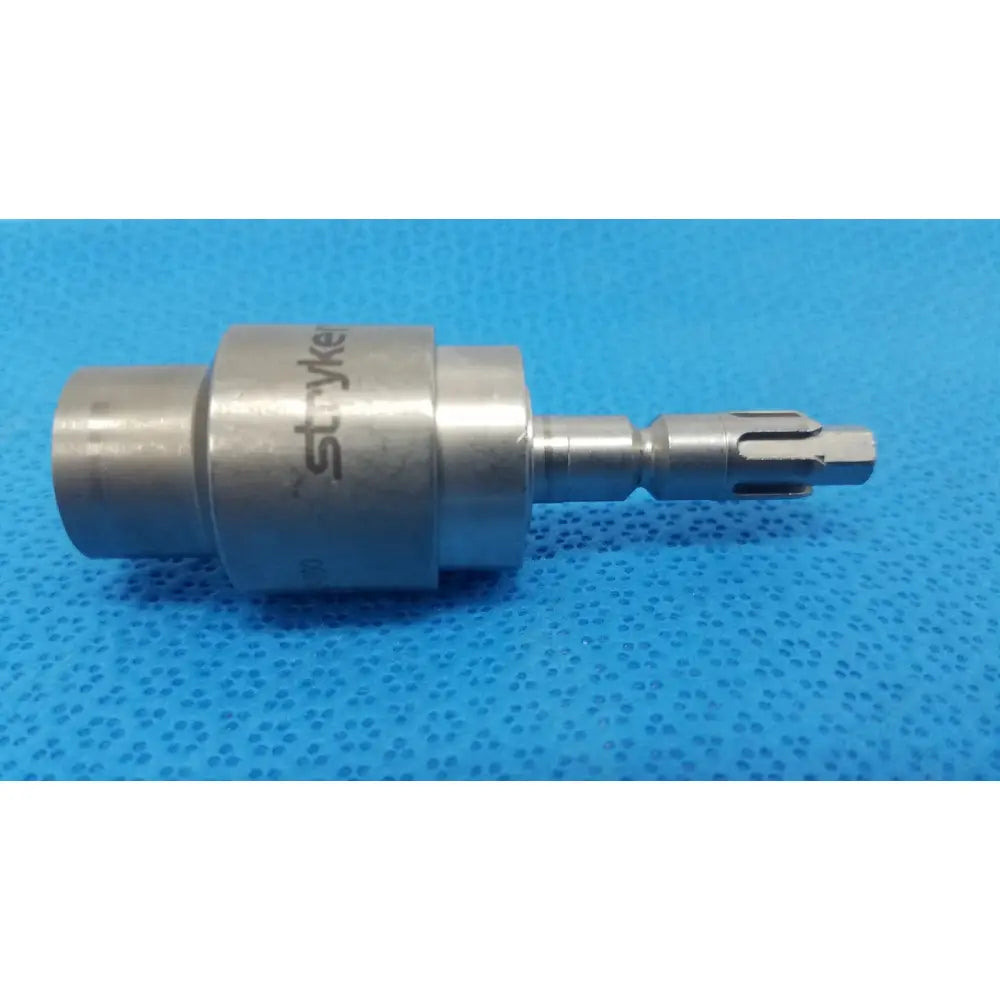 Silver metallic hudson modified trinkle surgical attachment with cylindrical body and serrated tip by stryker