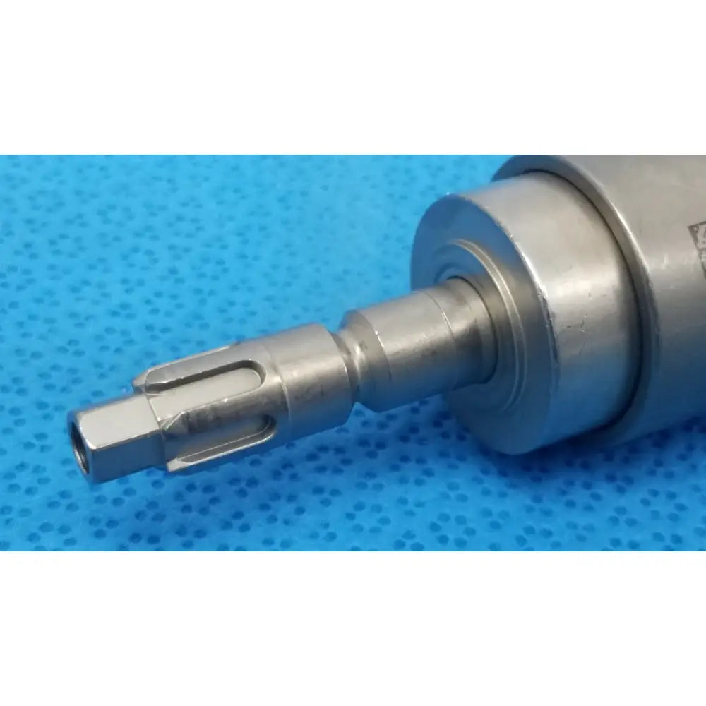 Stryker 6203-113-000 silver metallic dental handpiece with hexagonal drive end and machined grooves for reuse medical use