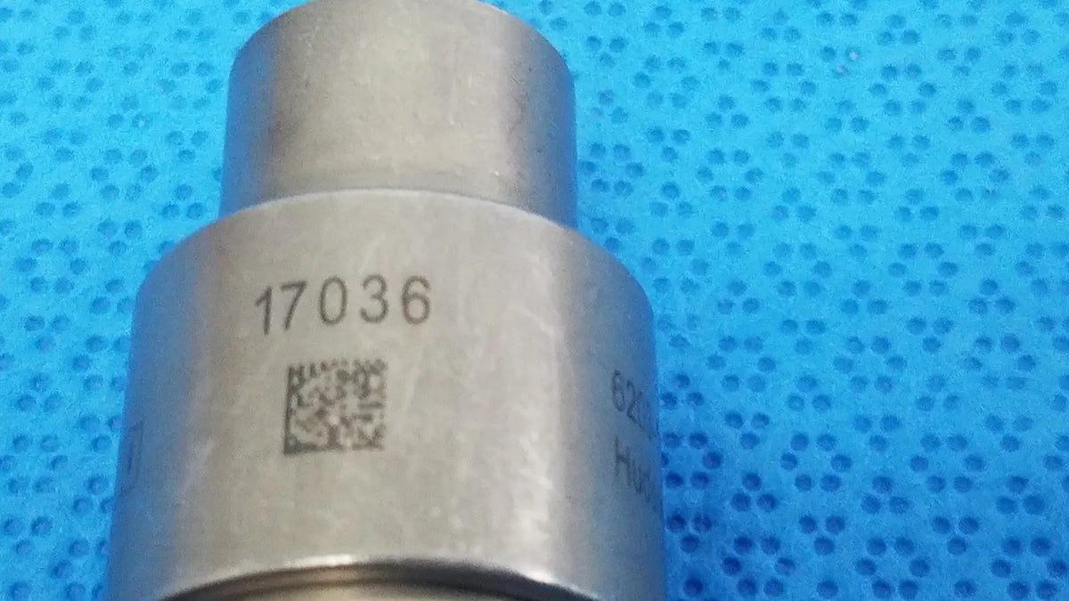 Silver metallic cylindrical component with engraved number 17036 and qr code for reuse medical stryker 6203-113-000 hudson