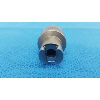 Silver-colored metal socket wrench with hexagonal opening and engraved branding for stryker hudson modified trinkle attachment