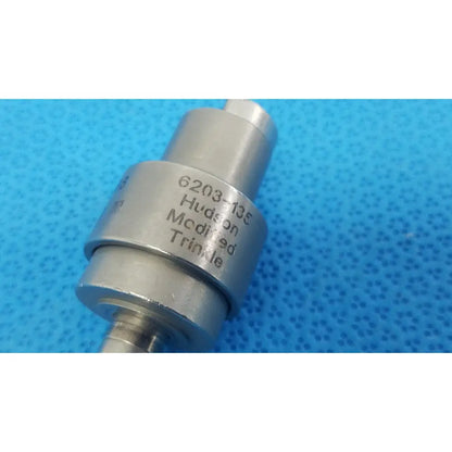 Silver metallic cylindrical stryker hudson modified trinkle attachment with engraved 6203-135 marking