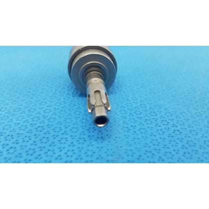 Silver-colored metal dental handpiece with textured cylindrical body and precision-engineered tip for hudson modified trinkle use
