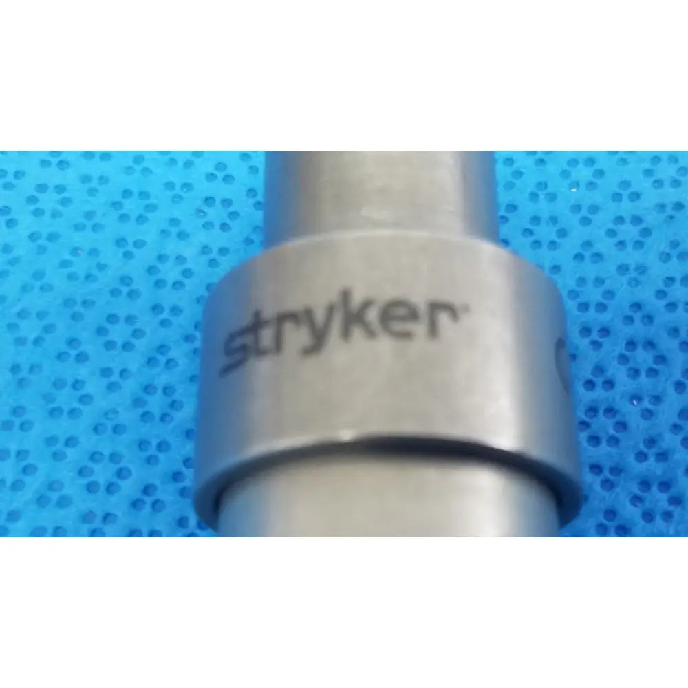 Silver metallic stryker hudson modified trinkle surgical instrument with cylindrical body and engraved brand name