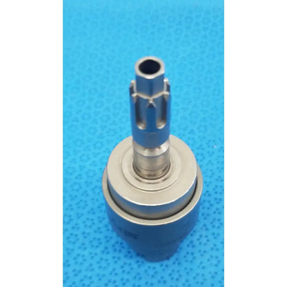 Silver-colored metal dental handpiece chuck with cylindrical shaft and gear-like protrusions for stryker hudson modified trinkle