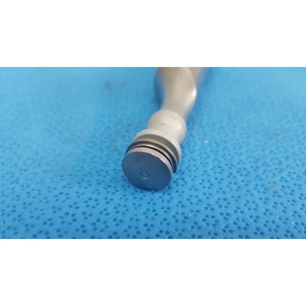 A sleek metallic pepper grinder with matte silver finish and grooved base shown with the remb electric oscillating saw