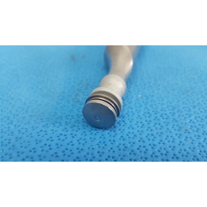 A sleek metallic pepper grinder with matte silver finish and grooved base shown with the remb electric oscillating saw