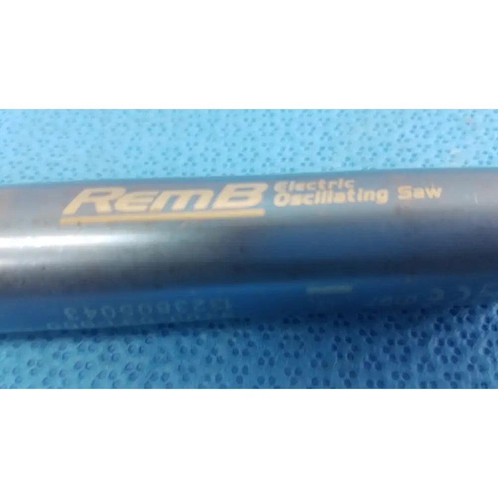 Dark gray Stryker 6400-031-000 remb electric oscillating saw with yellow lettering on handle for surgical use