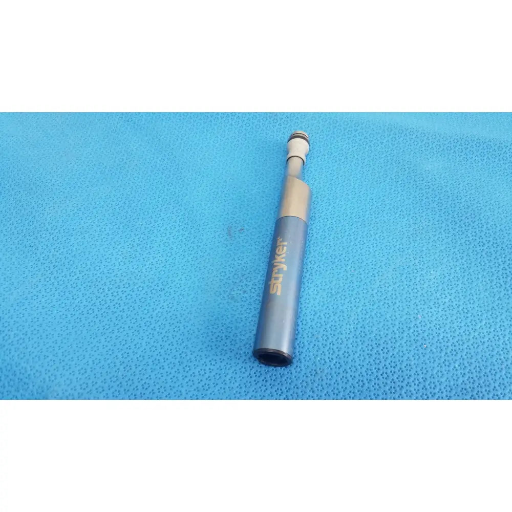 Gray stryker remb electric oscillating saw with metallic gold accent and black tip for precise surgical use