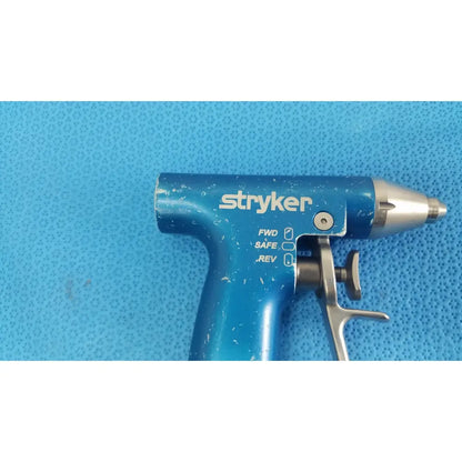 Blue stryker remb wiredriver handpiece with metallic tip and trigger mechanism for precise surgical use