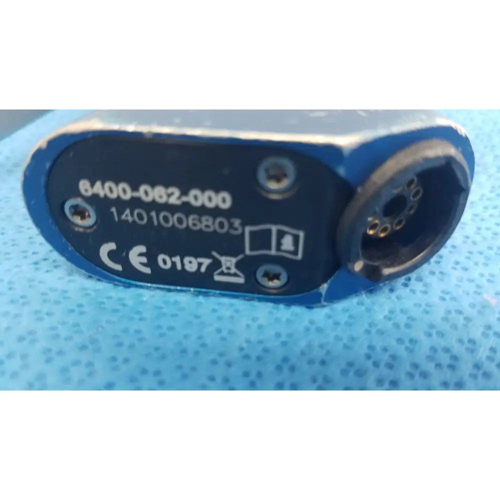 Blue industrial-grade electrical connector with black labeled serial and ce marks for the Stryker remb wiredriver handpiece