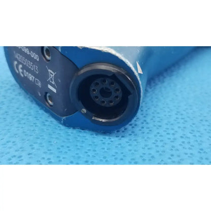 Blue plastic remb universal driver featuring a black circular connector with multiple holes for versatile use