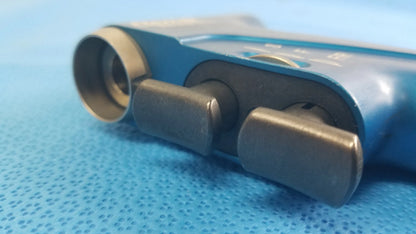 Blue plastic handheld stryker 6400-099 remb universal driver with black knobs and circular lens for reuse medical equipment