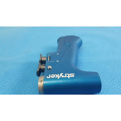 Blue stryker surgical instrument with metallic accents and labeled controls for reuse medical equipment by smiths medical