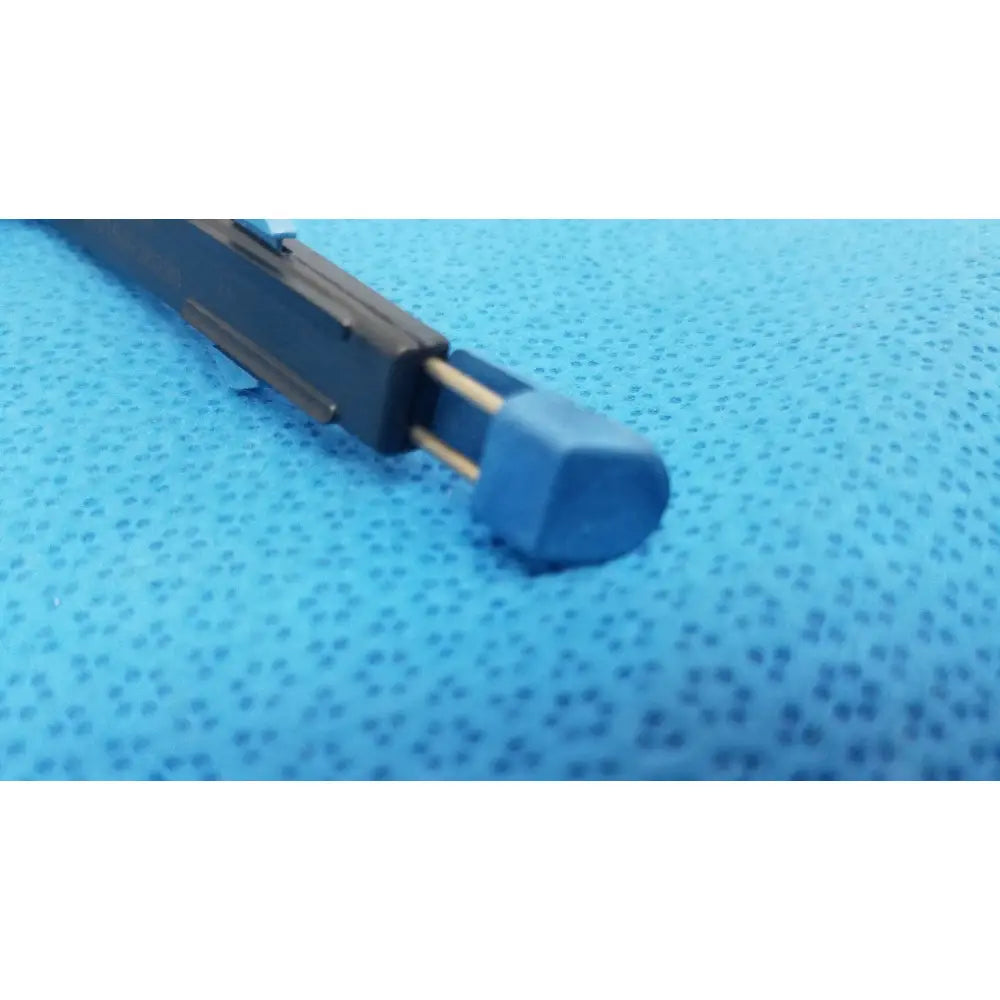 Black plastic pen with blue cap and gold metal clip shown with the Stryker 6400-9 Remb handswitch for reuse medical use