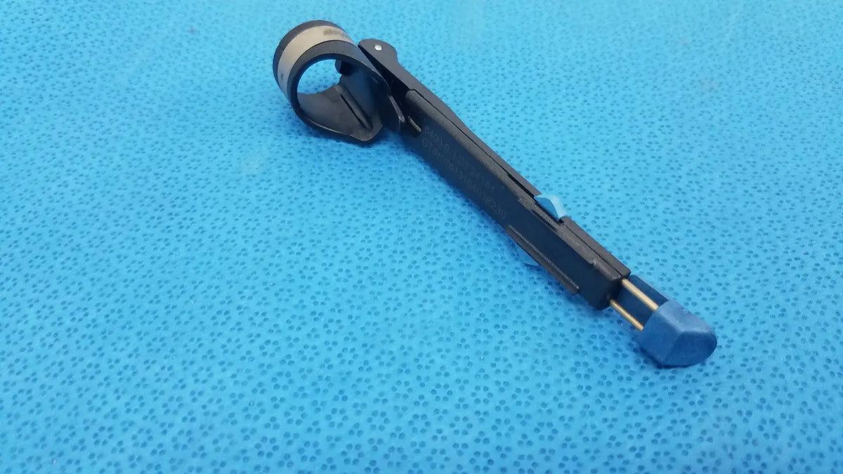 Stryker 6400-9 RemB Handswitch black and blue surgical clamp with textured grip handle for reuse medical applications