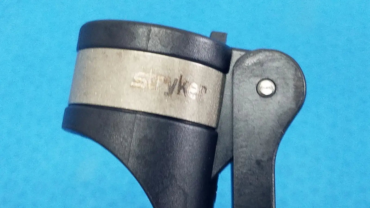 Stryker 6400-9 RemB handswitch with black plastic and metal handle and silver engraved brand band for reuse medical use