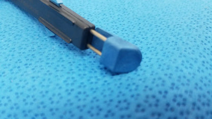 Black plastic pen with blue cap and gold metal clip shown with the Stryker 6400-9 Remb handswitch for reuse medical use