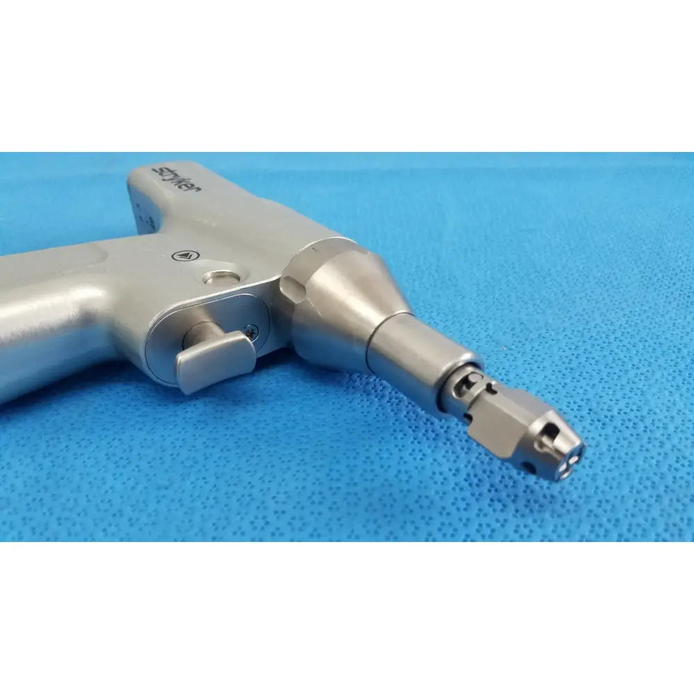 Silver Stryker 7206-000-000 System 7 reciprocating saw handpiece with textured grip and interchangeable bits for reuse medical orthopedic instruments