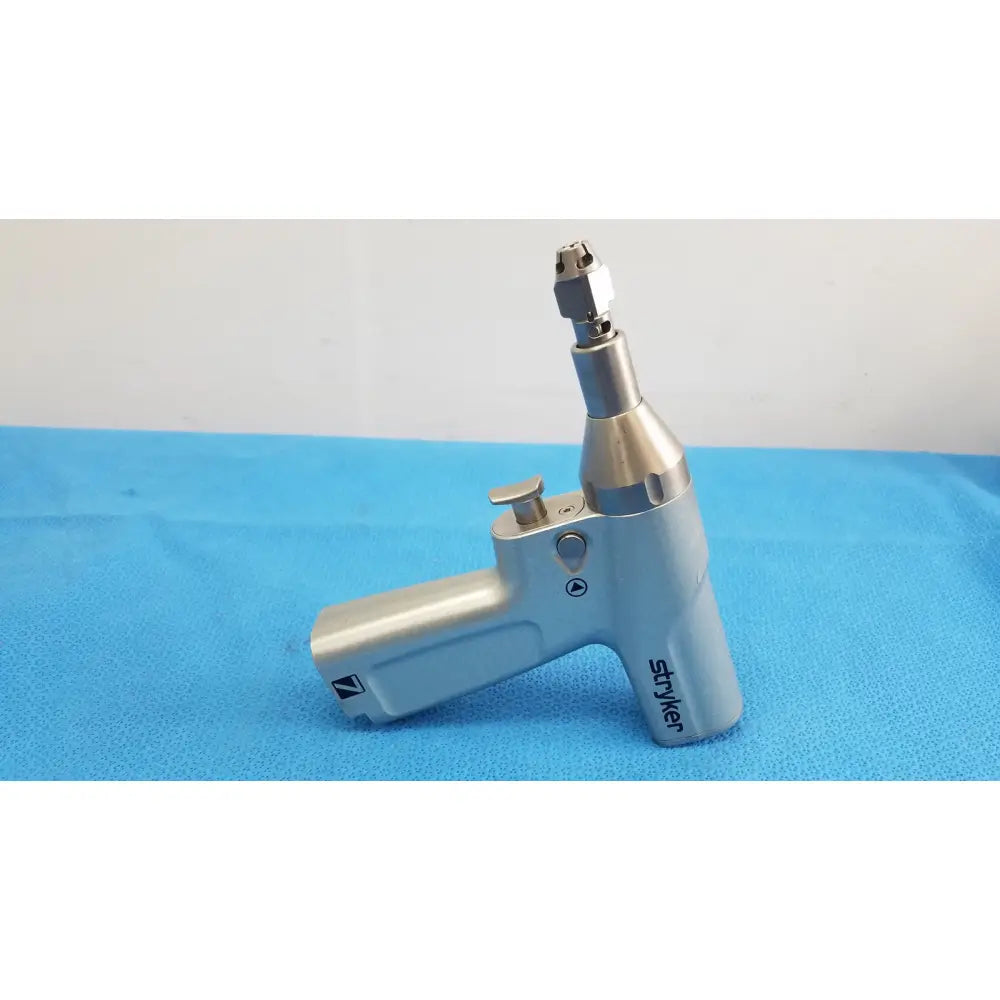 Silver-colored surgical drill handpiece with ergonomic design by stryker for reuse medical and orthopedic instruments use