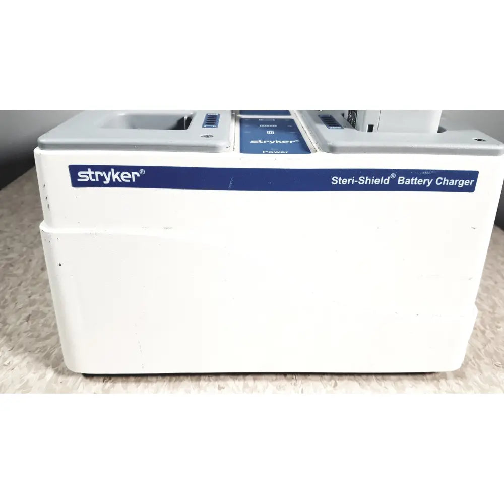 White stryker flyte battery charging station with blue branding and 8 slots for flyte battery charging use