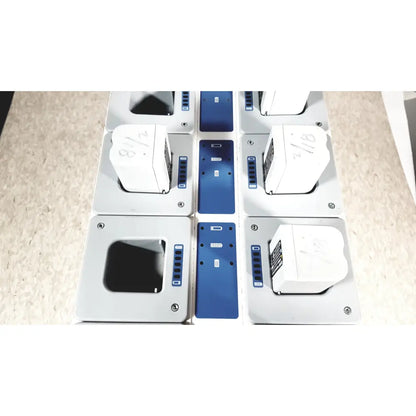 White rectangular battery packs with blue circuit boards and silver screws in stryker 8-slot steri-shield flyte battery charging station