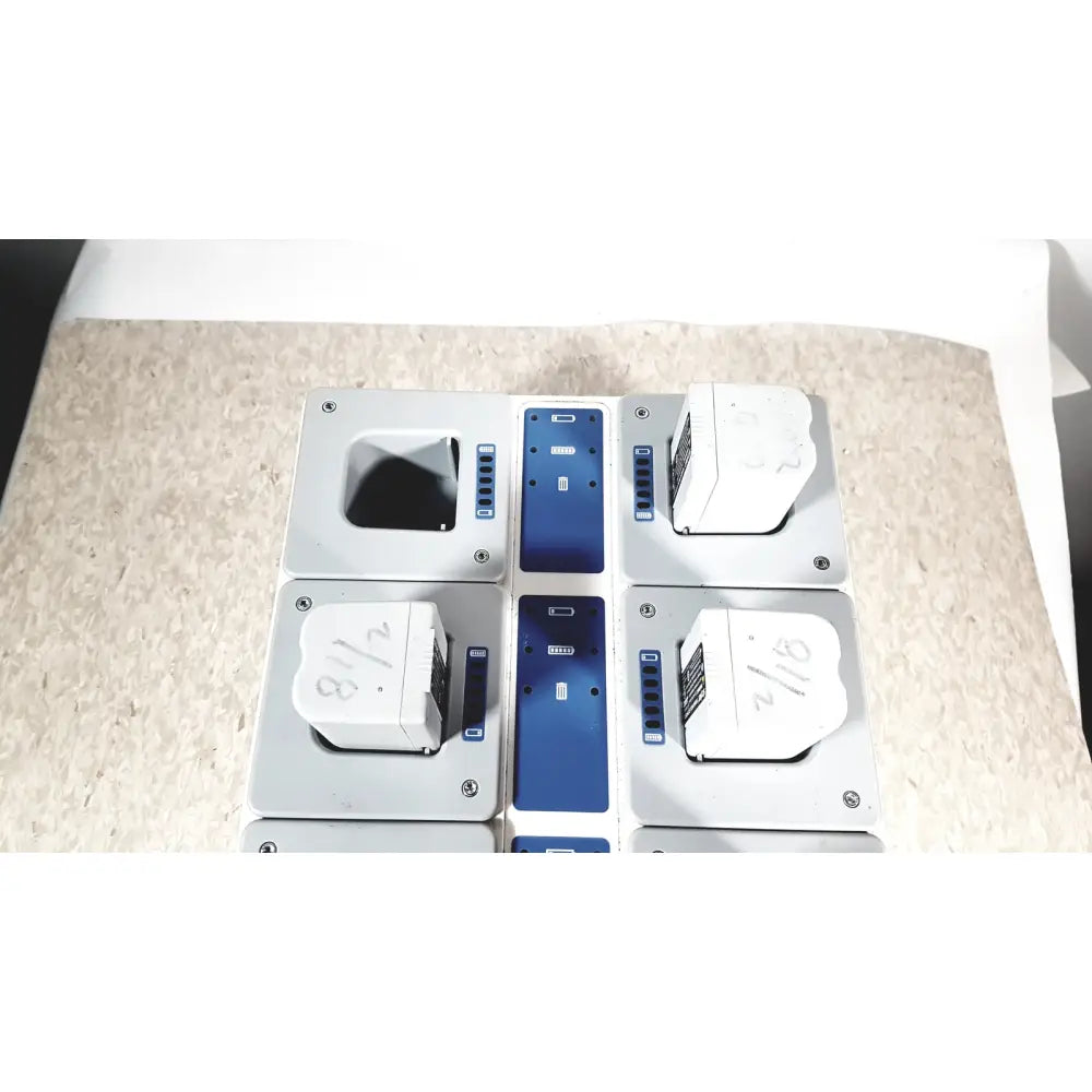 White and blue modular sections of stryker 8-slot steri-shield flyte battery charging station 0408-655-000 flyte battery charging