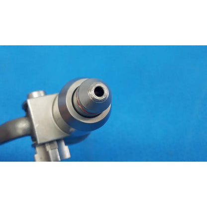 Silver-colored surgical pin collet with threaded tip and metallic housing for reuse medical orthopedic saws by stryker