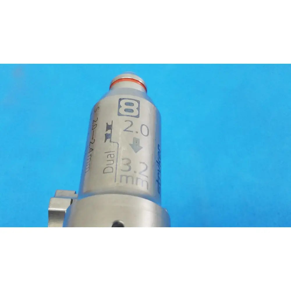 Stryker 8203-126-000 silver metallic pin collet with engraved markings and red-orange cap for reuse medical orthopedic saws