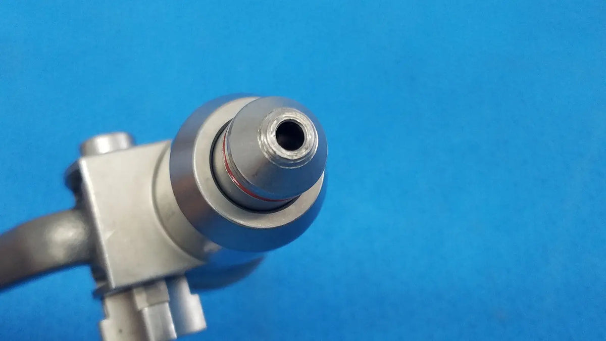 Silver-colored surgical pin collet with threaded tip and metallic housing for reuse medical orthopedic saws by stryker